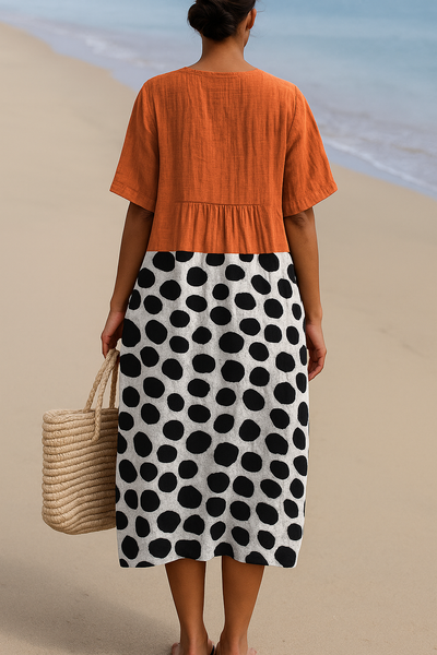 Maëlle | Orange dress with contrasting  polka dots