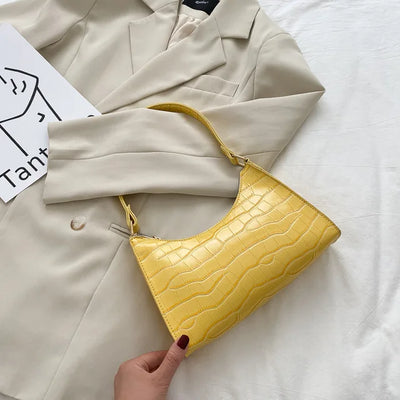 Georgina | A shiny shoulder bag with an alligator pattern