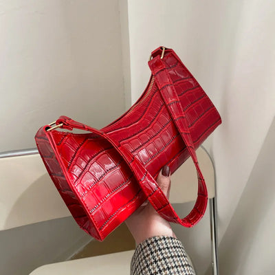 Georgina | A shiny shoulder bag with an alligator pattern