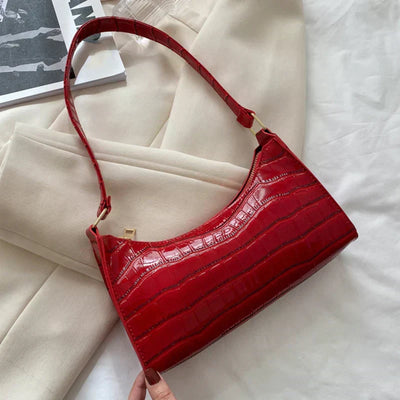 Georgina | A shiny shoulder bag with an alligator pattern
