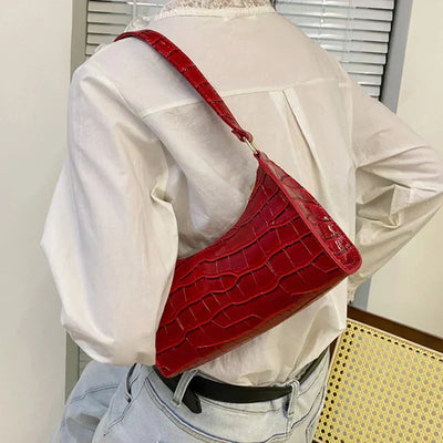 Georgina | A shiny shoulder bag with an alligator pattern