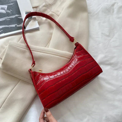 Georgina | A shiny shoulder bag with an alligator pattern