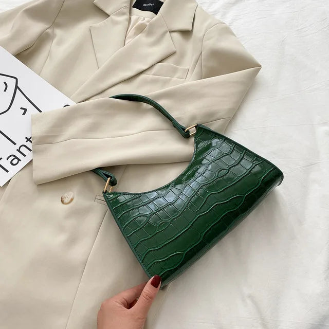 Georgina | A shiny shoulder bag with an alligator pattern