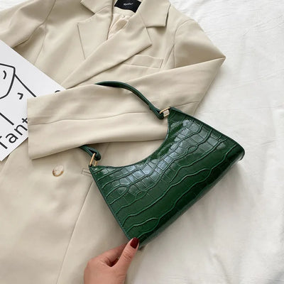 Georgina | A shiny shoulder bag with an alligator pattern