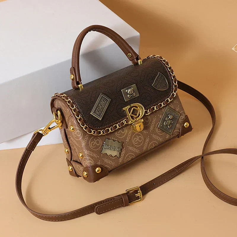 Camryn Retro shoulder bag with monogram and gold accents
