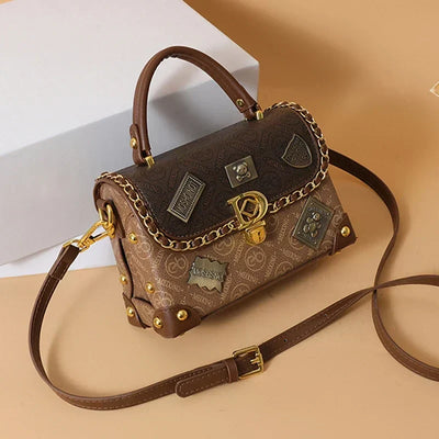 Camryn Retro shoulder bag with monogram and gold accents