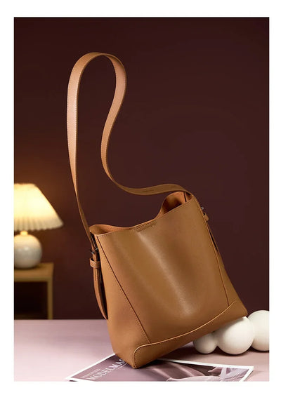 Moxie™ – A stylish sand-colored shoulder bag with a strap handle