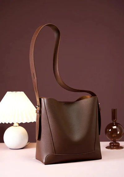 Moxie™ – A stylish sand-colored shoulder bag with a strap handle