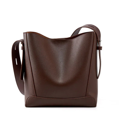 Moxie™ – A stylish sand-colored shoulder bag with a strap handle