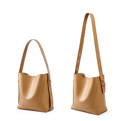 Moxie™ – A stylish sand-colored shoulder bag with a strap handle