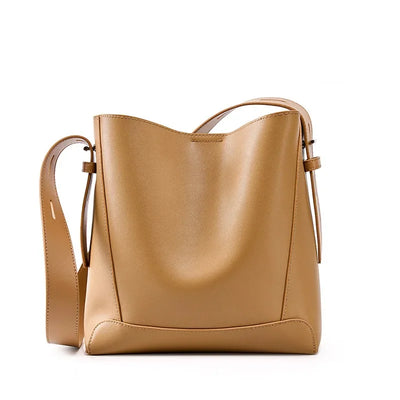 Moxie™ – A stylish sand-colored shoulder bag with a strap handle