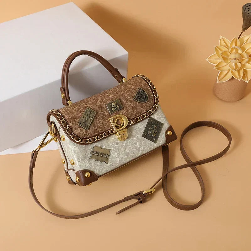 Camryn Retro shoulder bag with monogram and gold accents