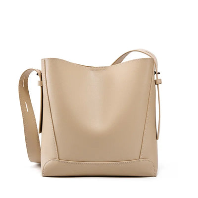 Moxie™ – A stylish sand-colored shoulder bag with a strap handle