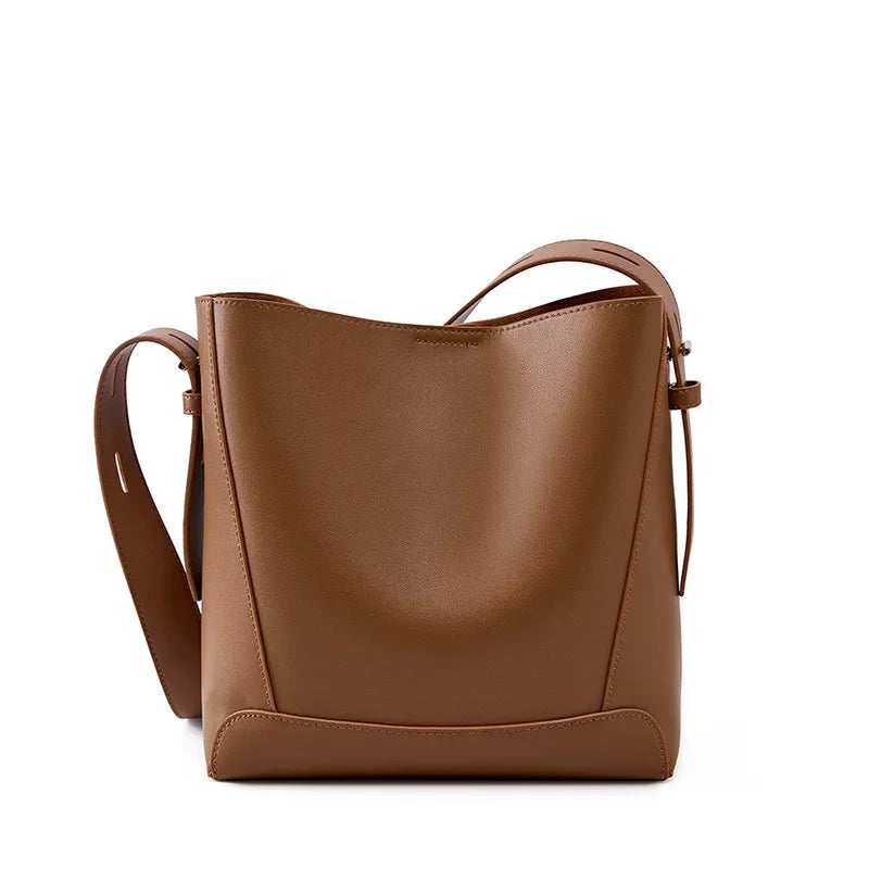Moxie™ – A stylish sand-colored shoulder bag with a strap handle